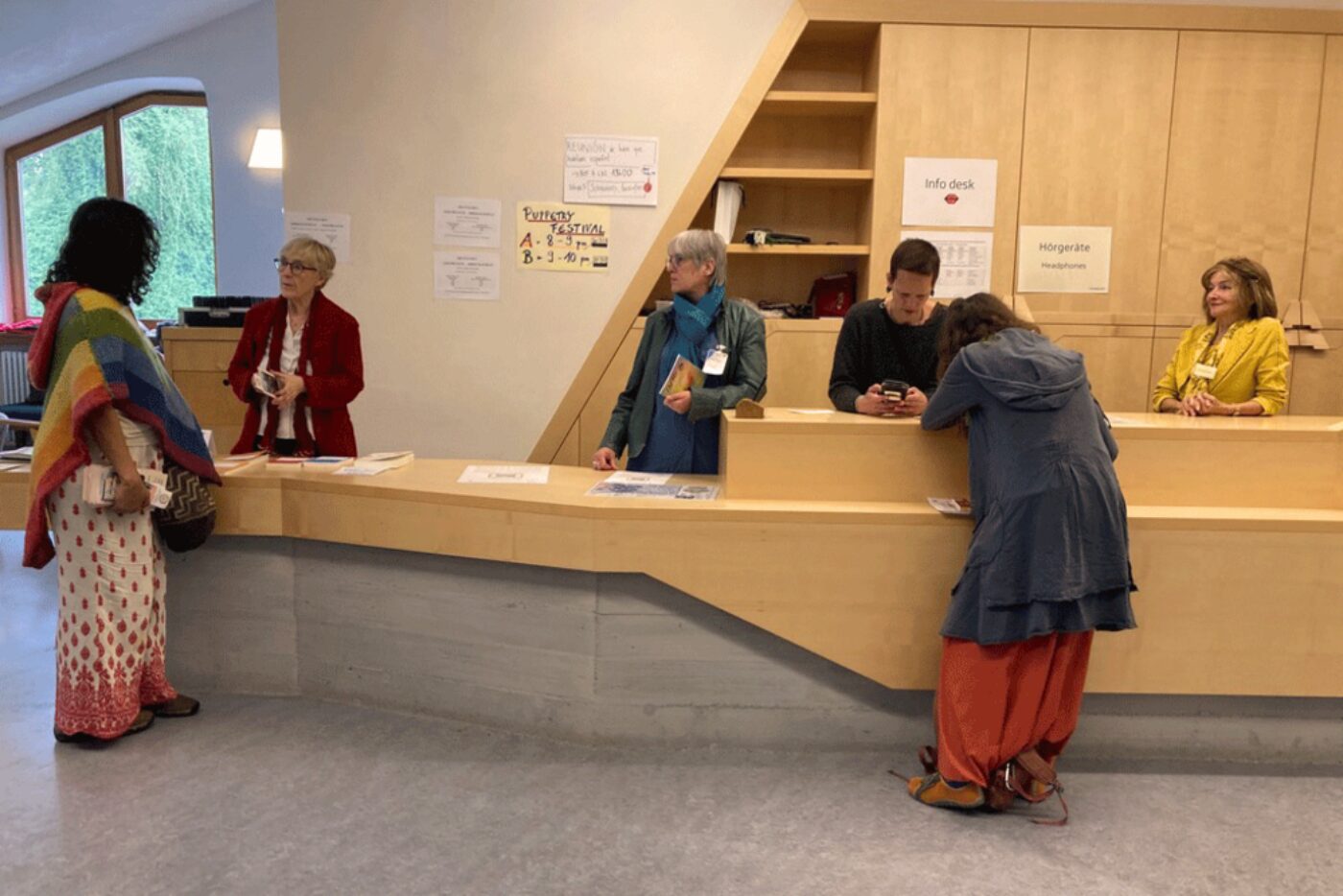 Lively activity among the ladies behind the information desk too. (Photo: Päd Sek/GG)
