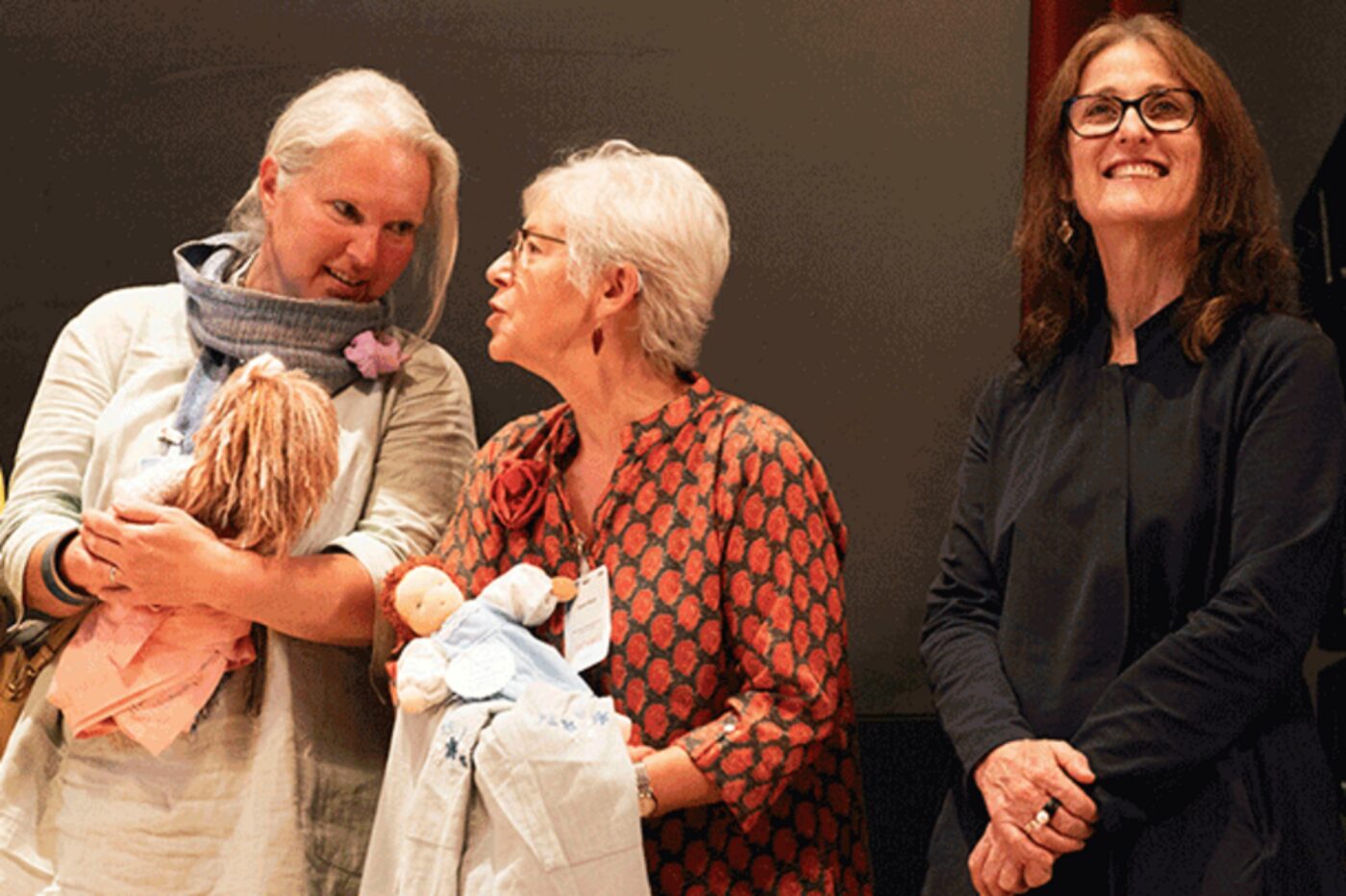 A close-up of two IASWECE fairies and a glowing leader of the Pedagogical Section. (Photo: Goetheanum/Xue Li)
